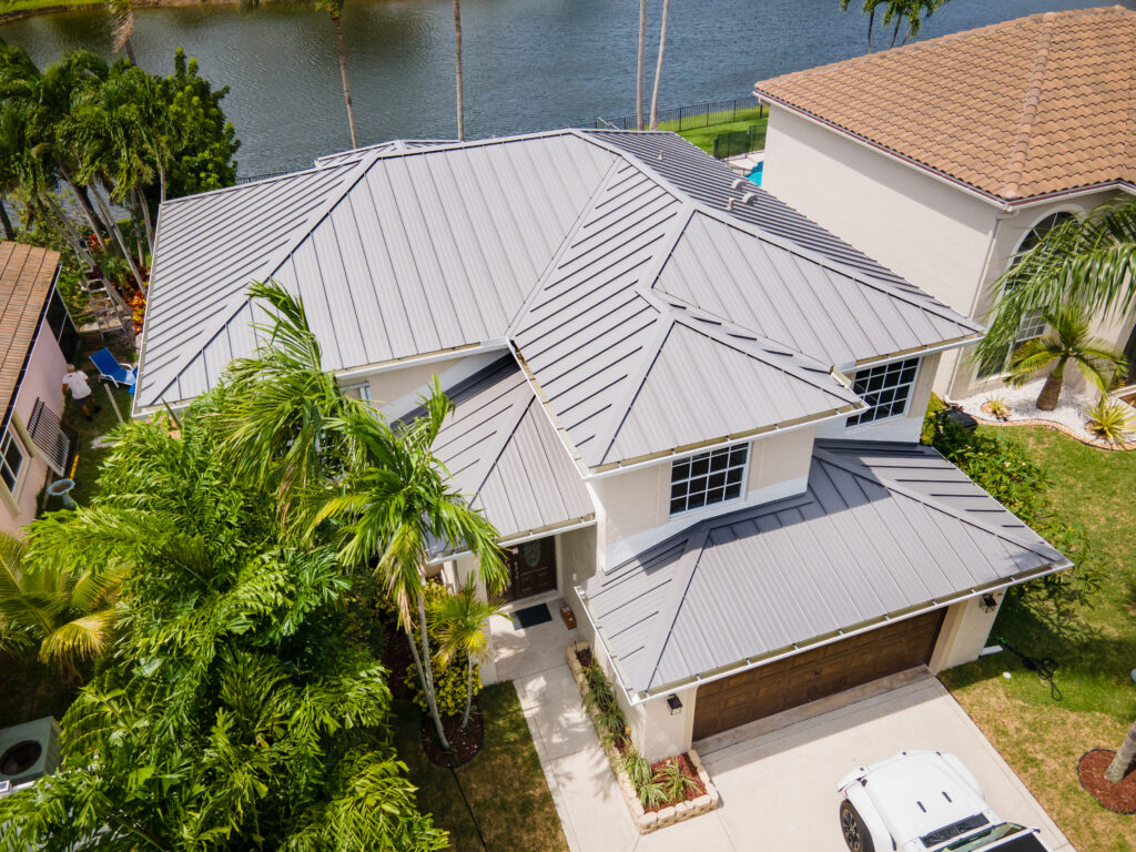 metal roof drone shot with palm tree